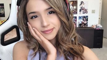 A selfie of Twitch streamer Pokimane posing on her gaming chair 