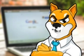 Shiba Inu character in front of internet on laptop