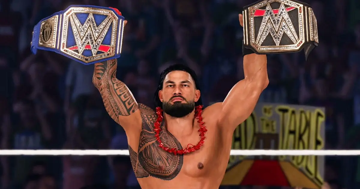 WWE2K23 gameplay image featuring Roman Reigns holding up belts