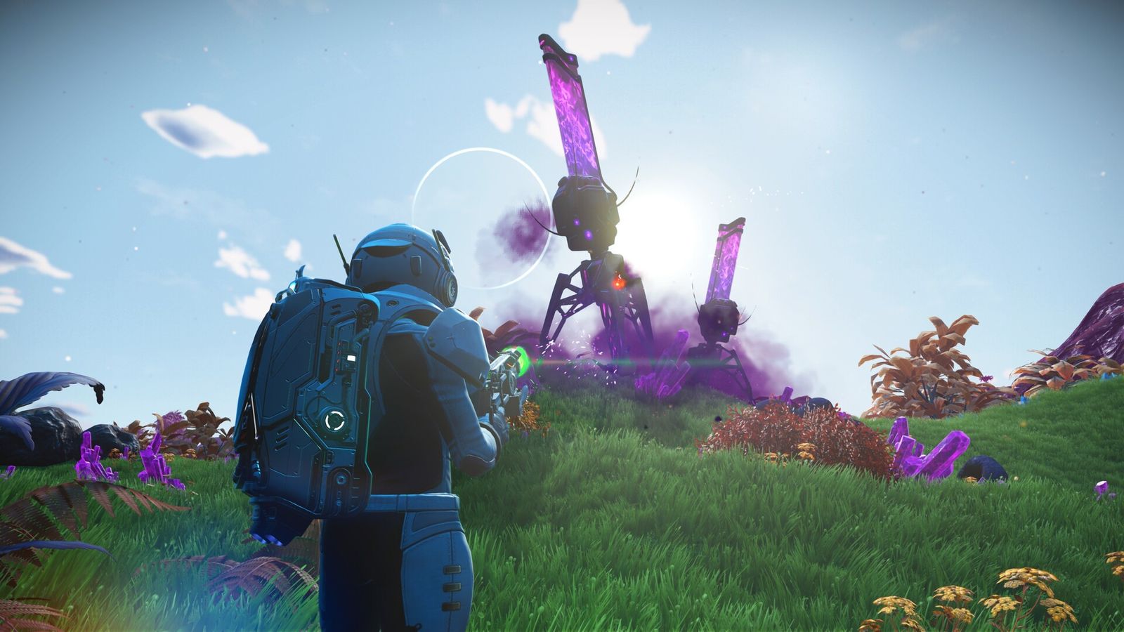In-game image from No Man's Sky of a character in a space suit aiming at a robot on a grassy planet featuring purple crystals.