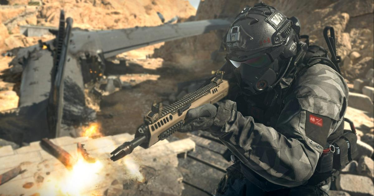 Screenshot of Warzone player firing Cronen Squall battle rifle next to a plane wreckage in the desert