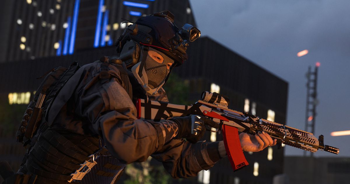 Screenshot of Warzone player holding an assault rifle in front of a dark building