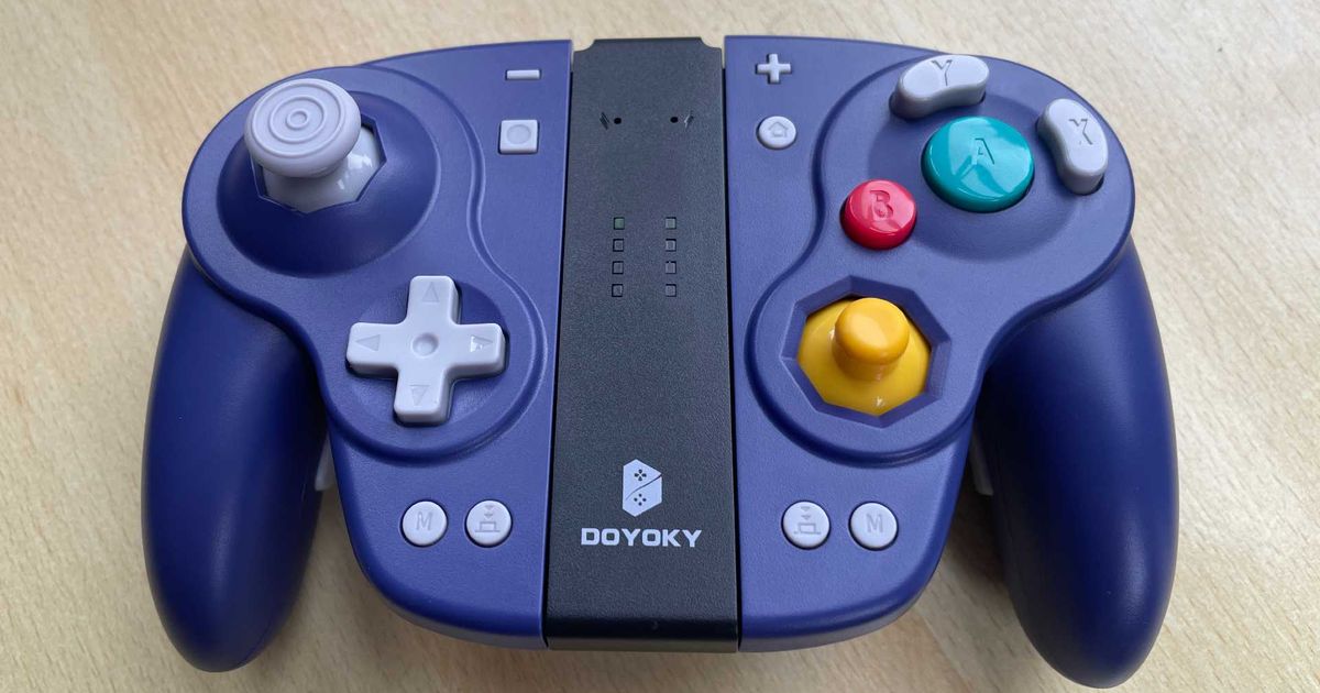 The DOYOKY Wireless Joy-Con retro game controller connected to its charging base.