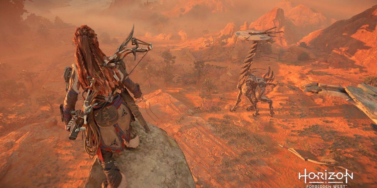 Horizon Forbidden West Aloy is standing on top of the Satellite Dish looking at the Cinnabar Sands Tallneck