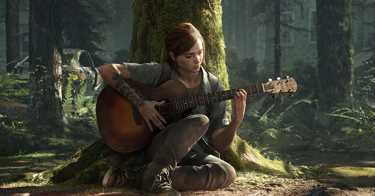 Ellie playing a guitar against a tree in The Last Of Us 2