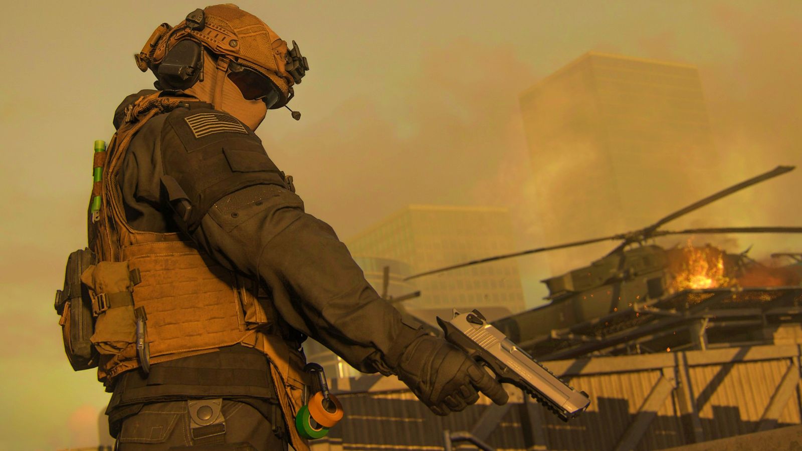 Modern Warfare 3 (2023) - soldier in tactical desert gear points a pistol downwards