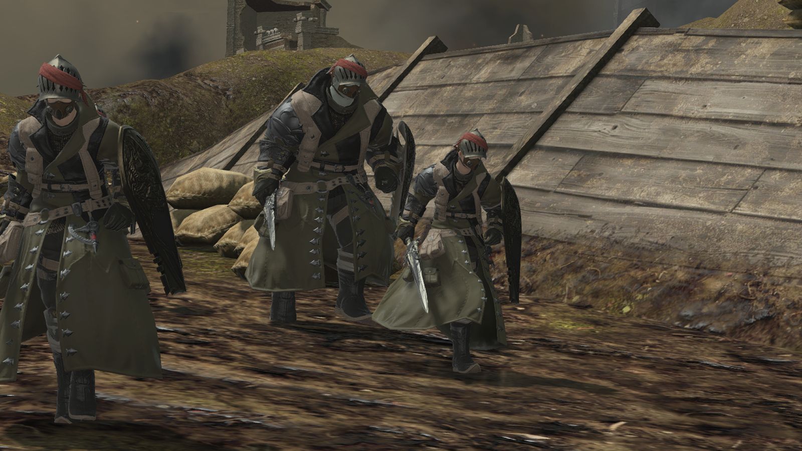 An image of three soldiers moving through the Bozjan Southern Front, a war-torn area used while obtaining the Shadowbringers Relic Weapons. They are dressed in heavy combat gear.