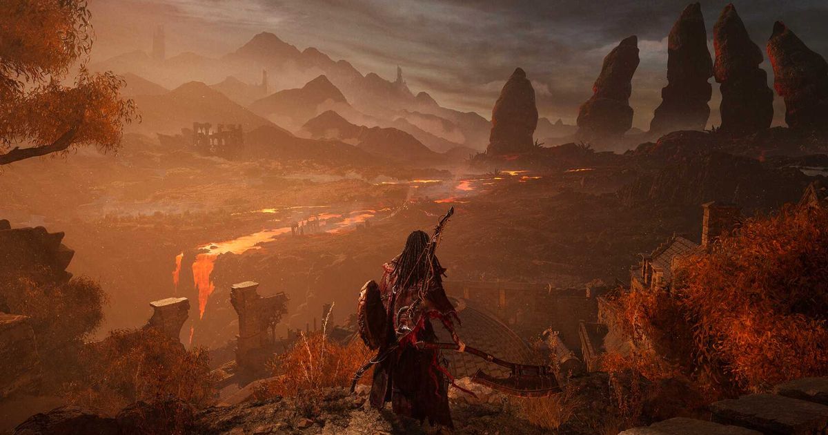 A character looking over a reddish forest in Lords of the Fallen.