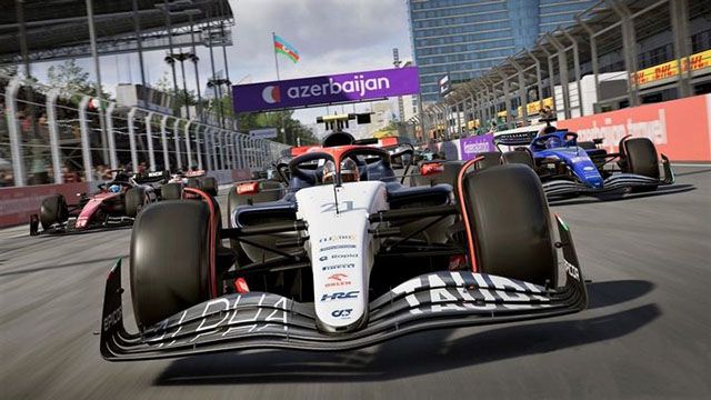 Screenshot of AlphaTauri F1 car in F1 23 with Williams and Alfa Romeo in the background