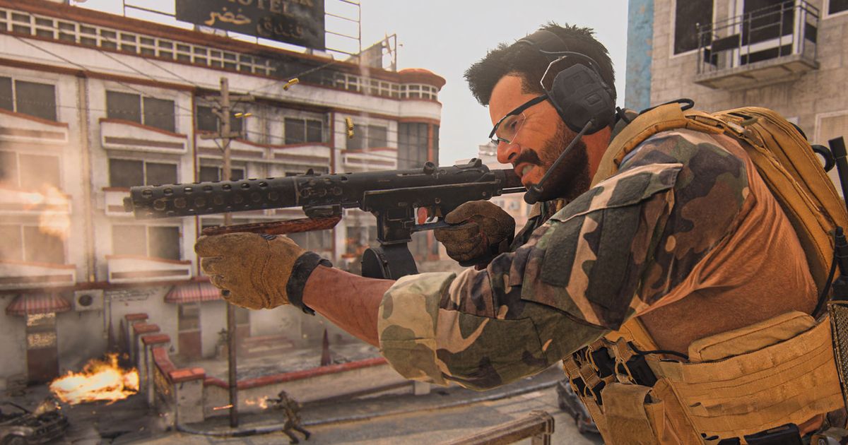 Modern Warfare 2 player firing SMG with building in background