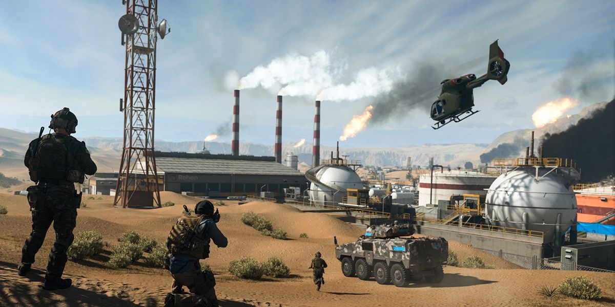 Screenshot of Modern Warfare 2 players standing near building while vehicles move in front of them and in the air