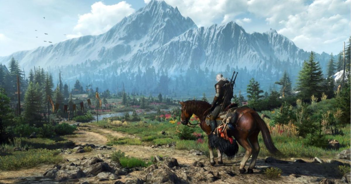 The Witcher is next to the forest and mountains.