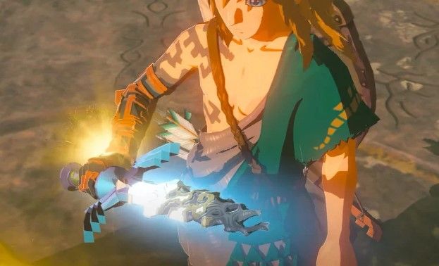 Link holding the broken Master Sword in Zelda Tears of the Kingdom.
