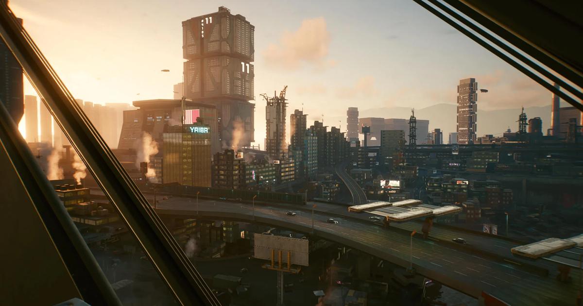 Screenshot from Cyberpunk 2077, showing a cityscape in the evening, with the sun soon to settle.