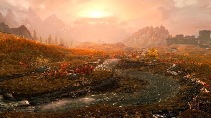 A creek with running water against a sunset in Skyrim.