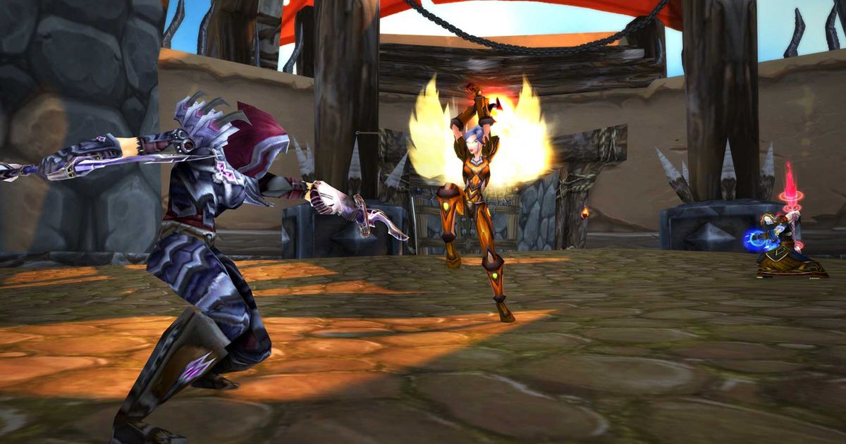 Three WoW characters fighting in the Outland arena.