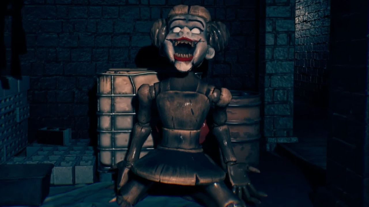 A damaged doll with blank eyes and a large, toothy grin.