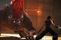 Screenshot from Crisis Core: Final Fantasy VII Reunion, featuring Zack wielding a massive sword and fighting a huge four-legged beast.