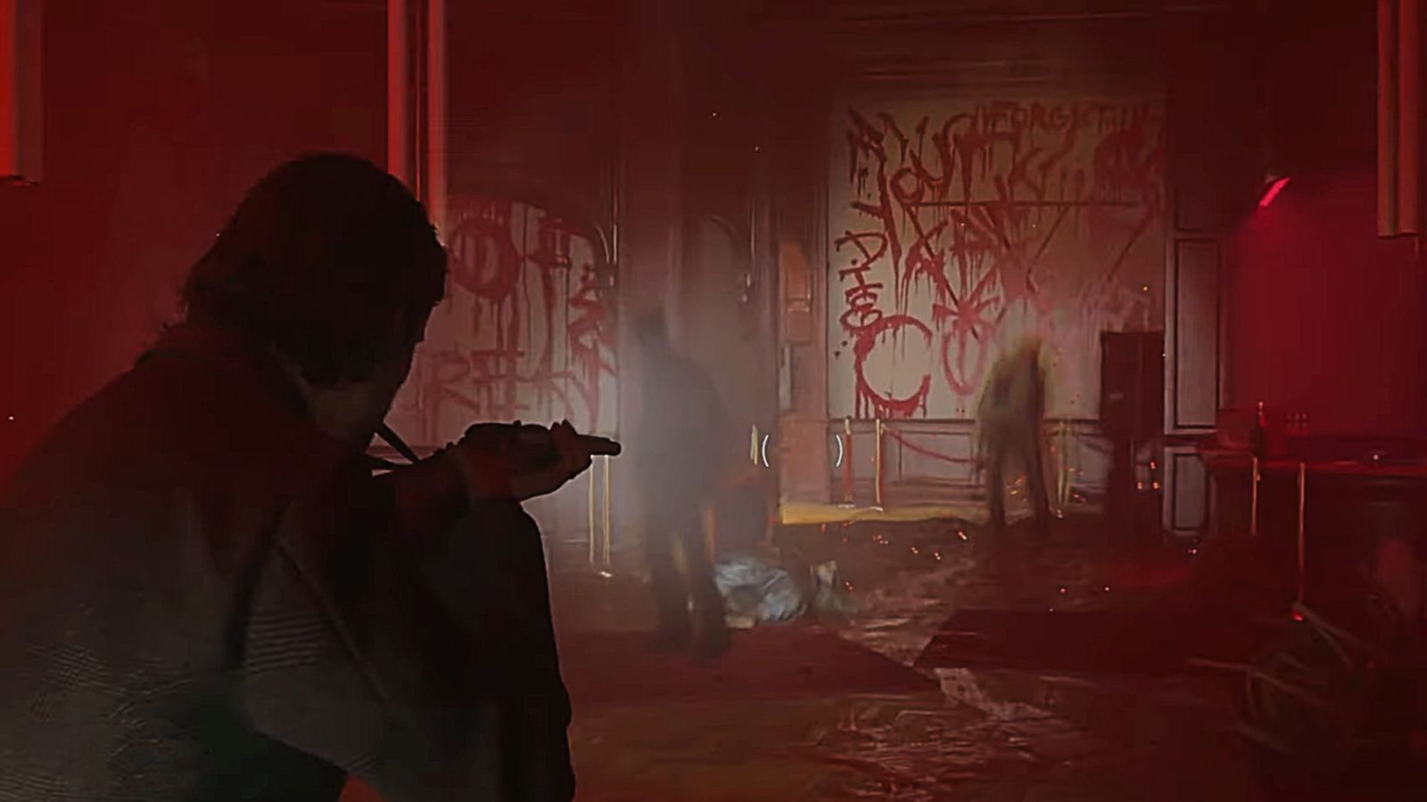 Alan Wake 2: Alan Wake holding a shotgun at some shadows, stood in front of red graffiti