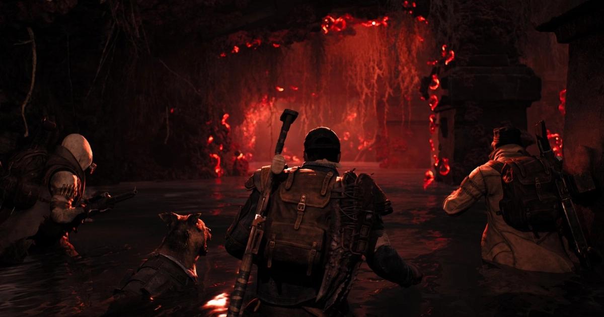 a character going into a creepy red cave in Remnant 2