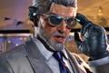 Tekken 8 - Victor Chevalier, man with grey hair and beard, in a grey suit and leather gloves.