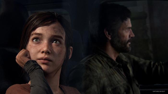 Ellie and Joel sitting in a car together, in The Last of Us.