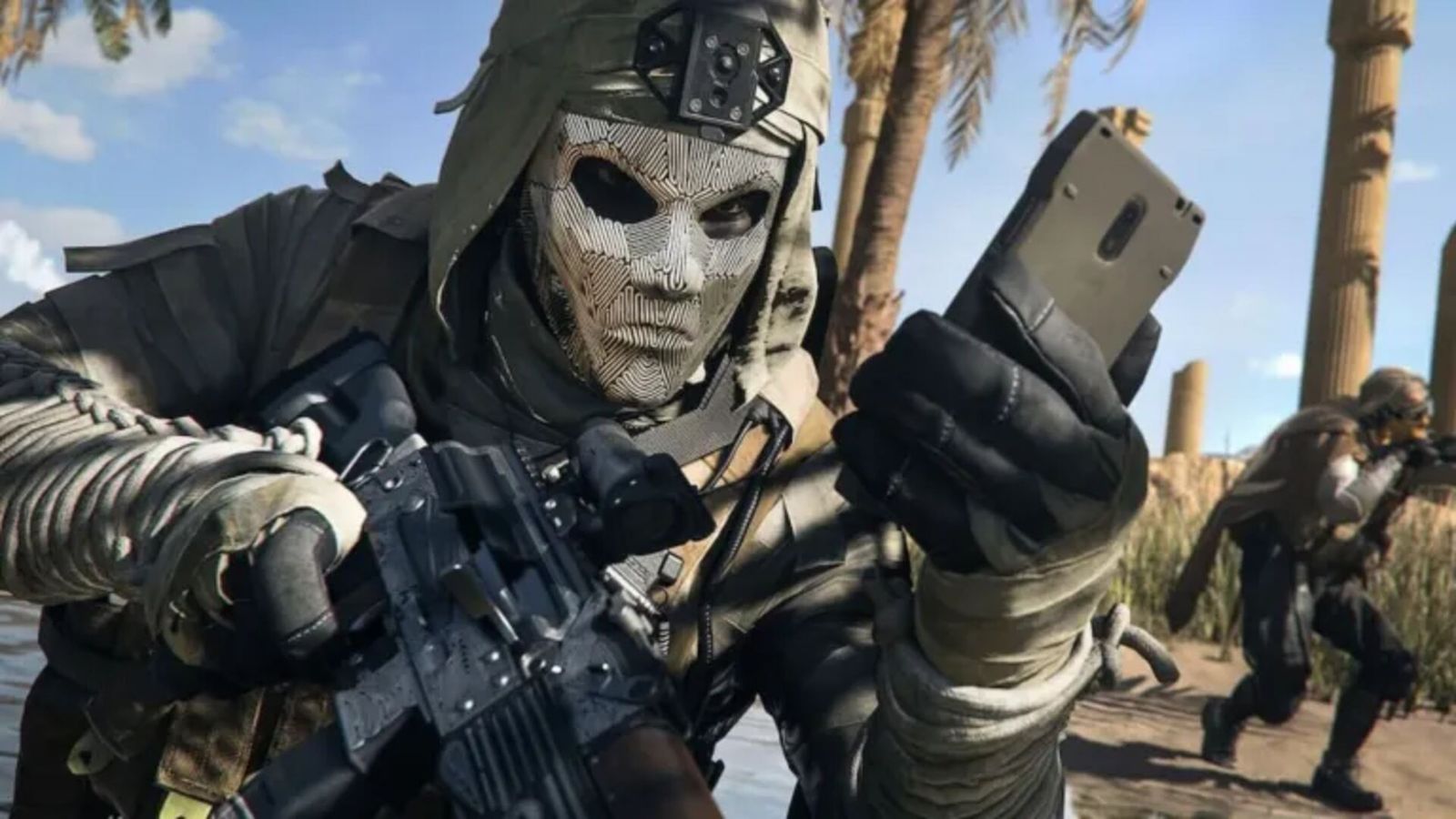 Masked Warzone player using mobile device