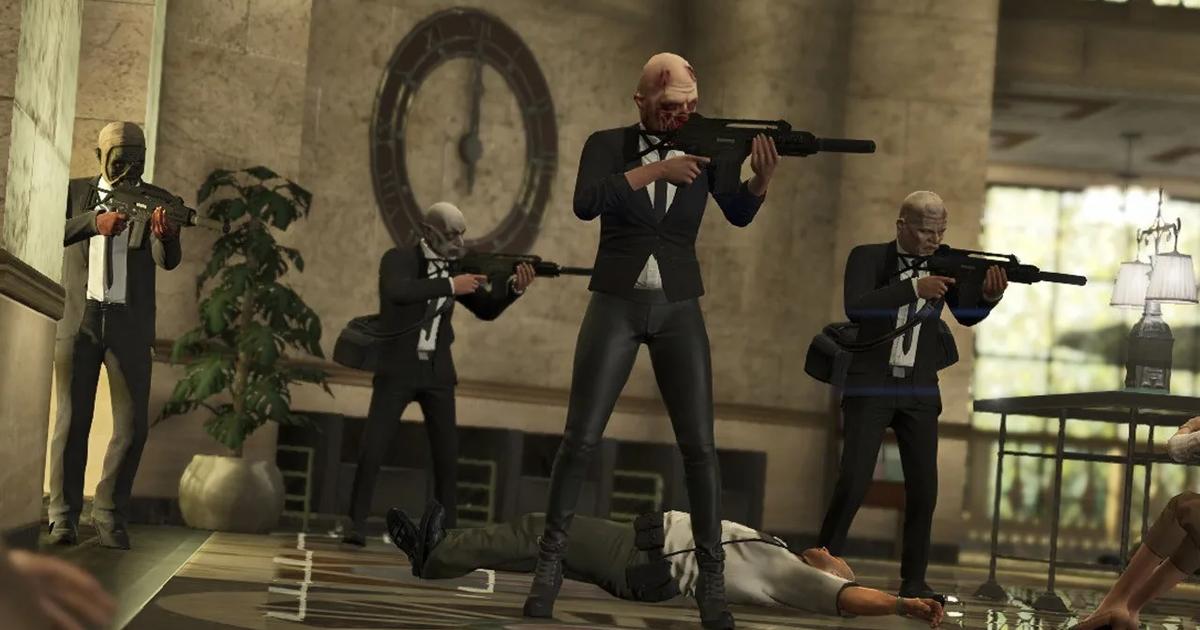 GTA Online players holding guns wearing mask and suit