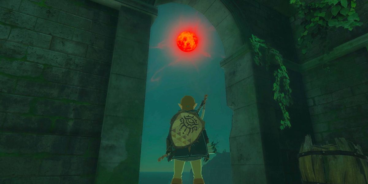 Link looking at a red moon in Zelda Tears of the Kingdom.