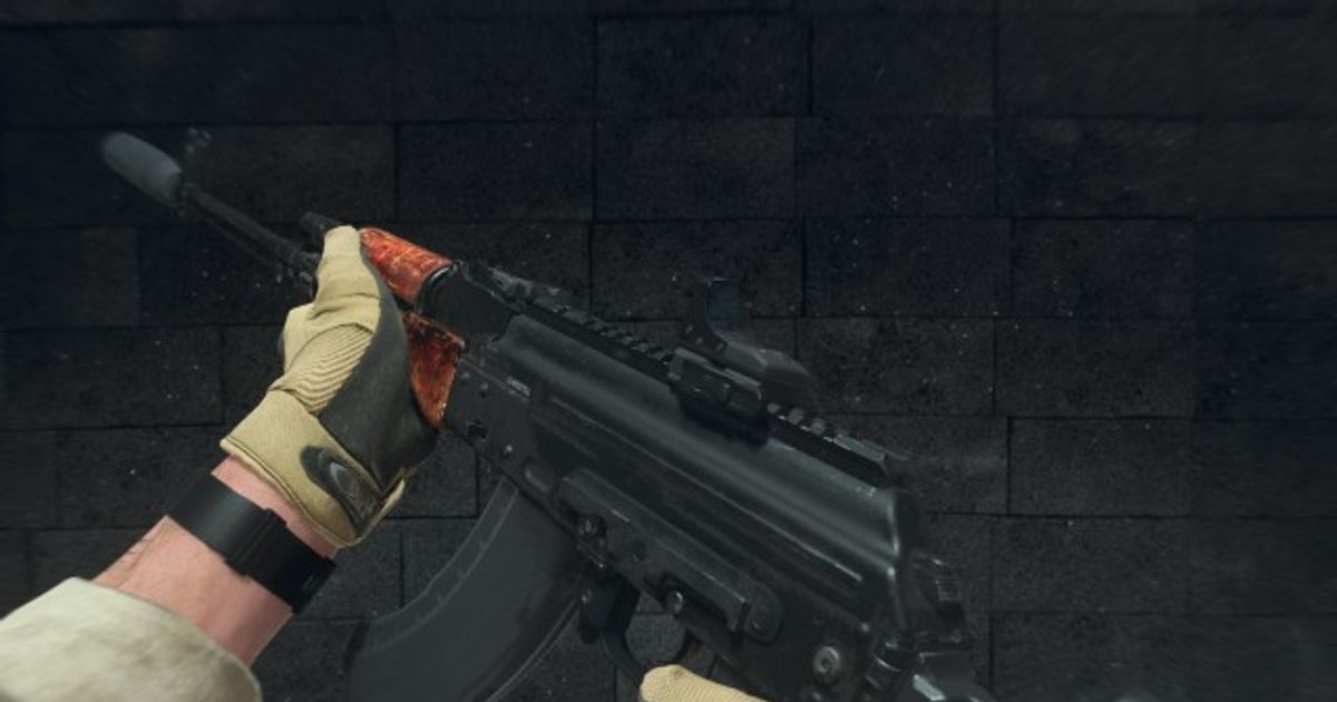Modern Warfare 3 Kastov 762 assault rifle being held by player wearing black and yellow gloves