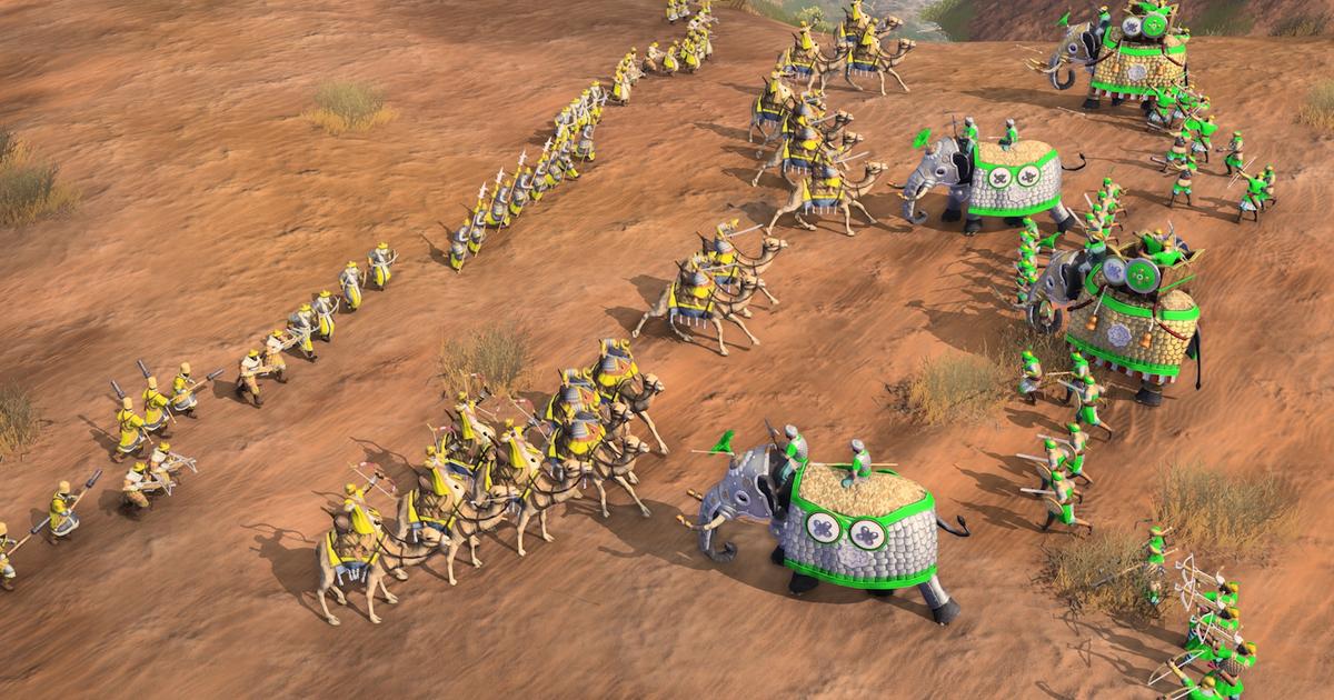 A battle in Age of Empires 4 between two civilisations on a desert terrain.