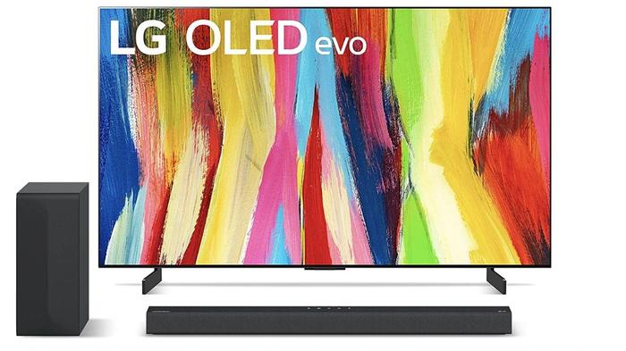 Best cheap TV - LG C2 product image of a near-frameless TV with a multi-coloured pattern on the display.