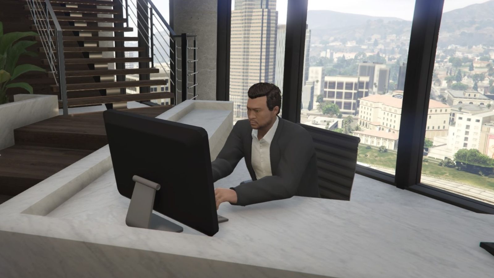 GTA Online The Contract DLC Agency Reception. The reception worker/bodyguard is sitting behind a white marble desk and is on his computer.