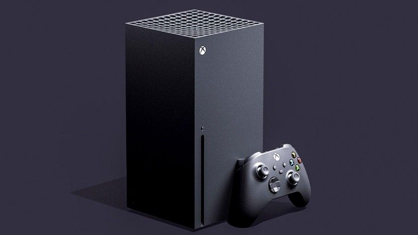 A black Xbox Series X with a controller leaning against it.