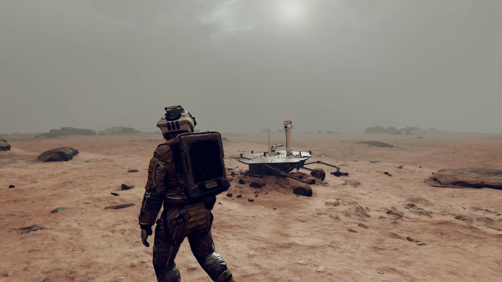 The player character walking along a rocky planet in Starfield.