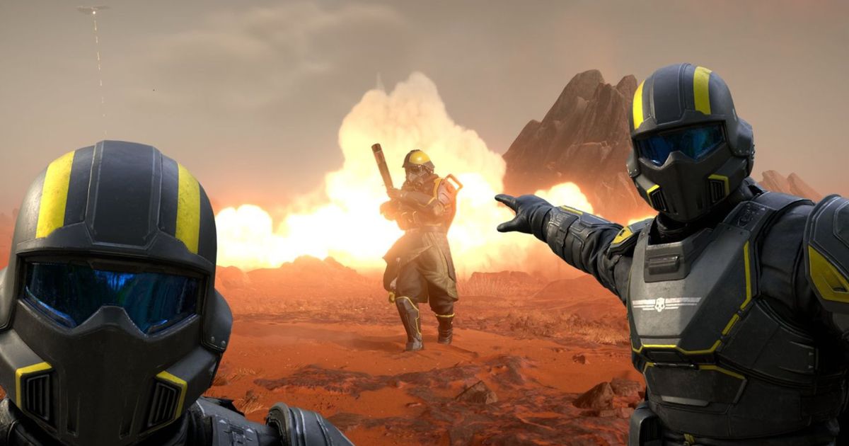 Helldivers 2 player pointing at player emerging from flames