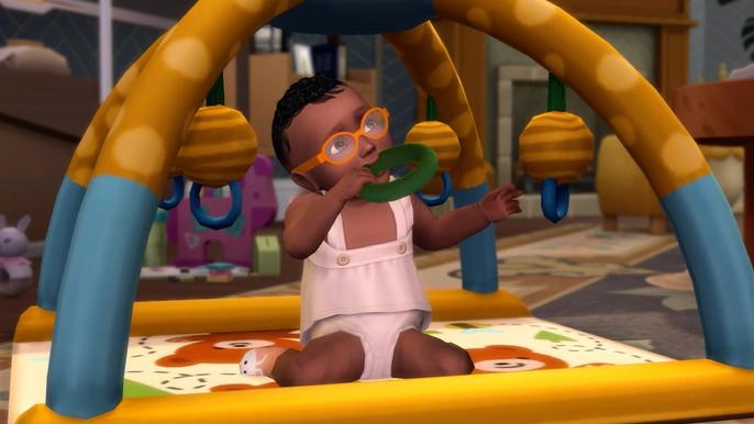 An infant interacting with a playmat