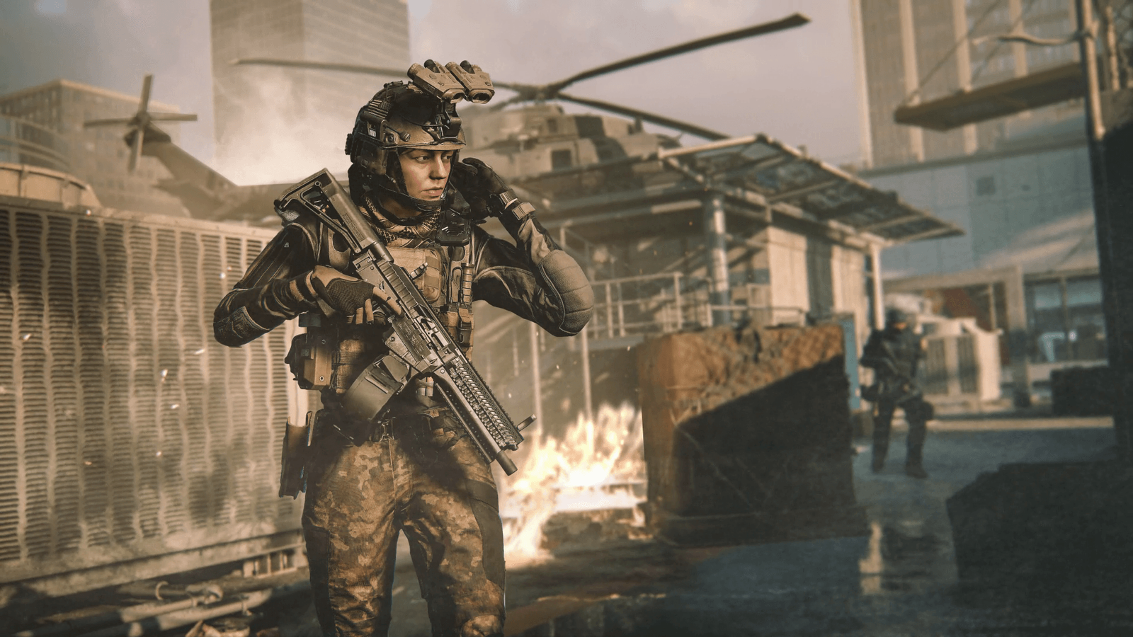 Modern Warfare 3 holding gun and raising hand to helmet with opponent and care package in background