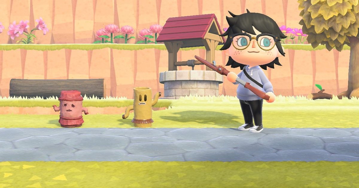 A player standing beside two Gyroids in Animal Crossing: New Horizons.