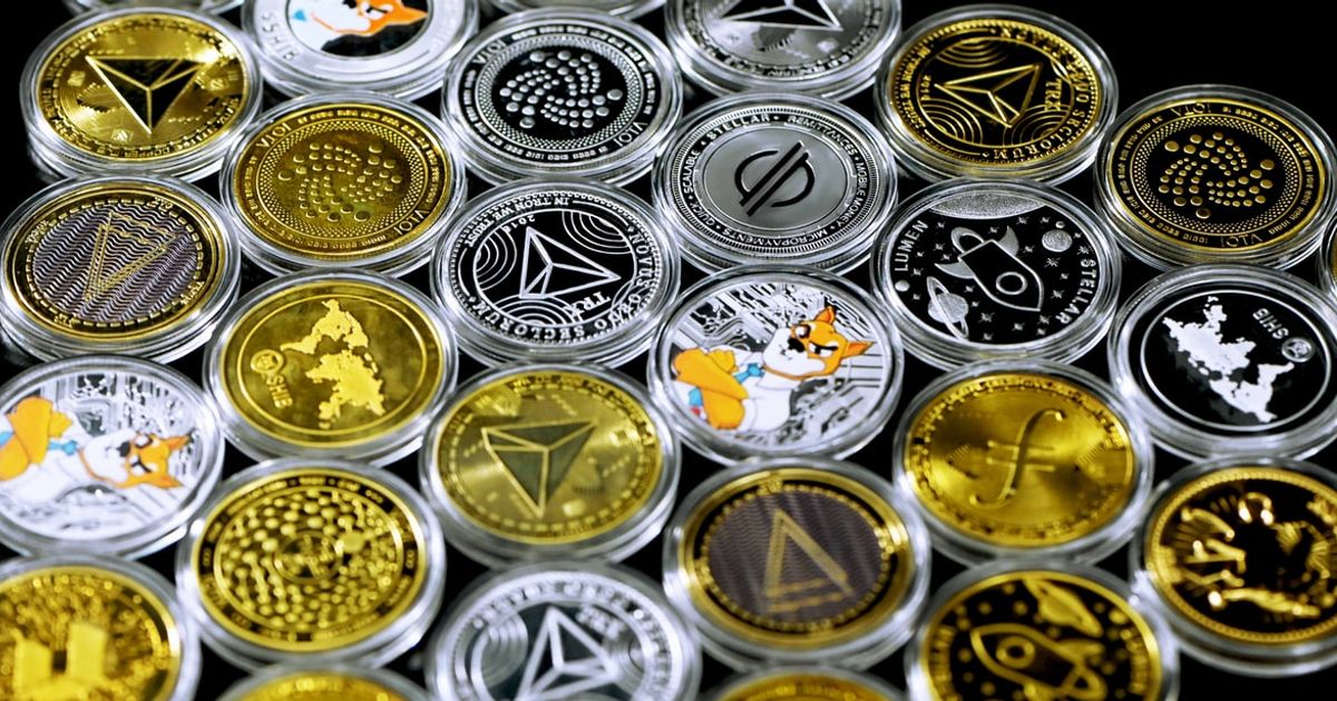 Various cryptocurrency tokens on a table.