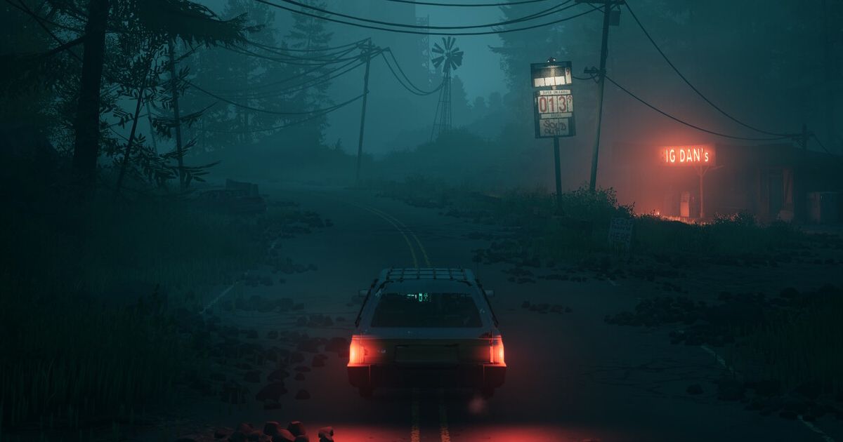 A car driving in a dark forest environment with a gas station on the right.