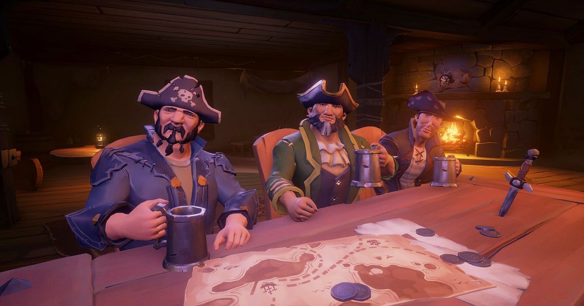 Three pirates sat at a table in Sea of Thieves.