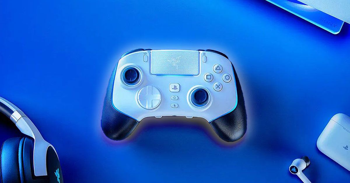 A white and black Razer PlayStation controller with a white glow around it sat on a blue desk.