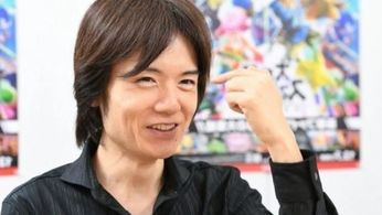 Smash Bros creator Masahiro Sakurai posing with a fist in the air in jubilation 