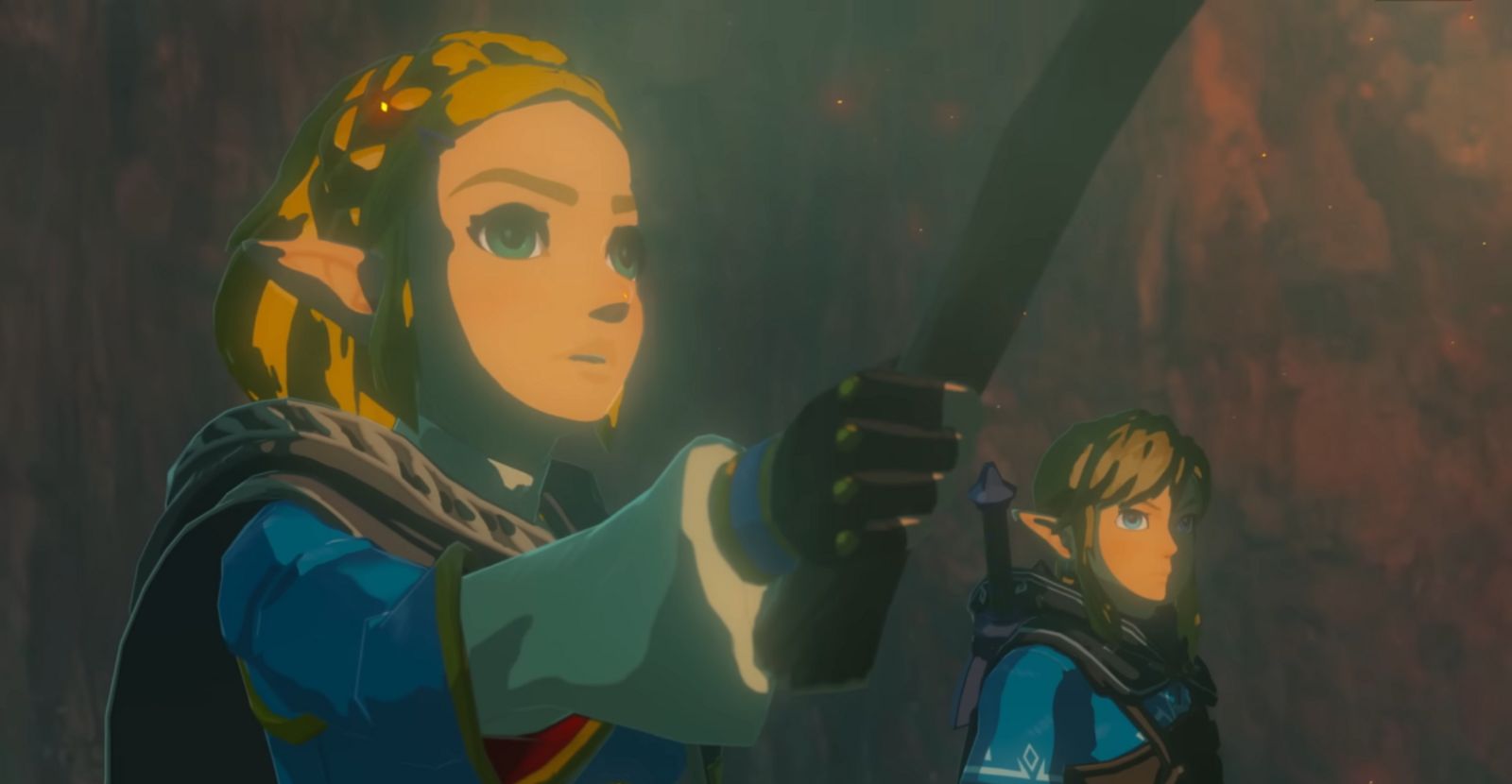 Image of Link and Zelda holding a torch in a cave.