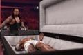 undertaker putting a wrestler in a coffin in wwe 2k24