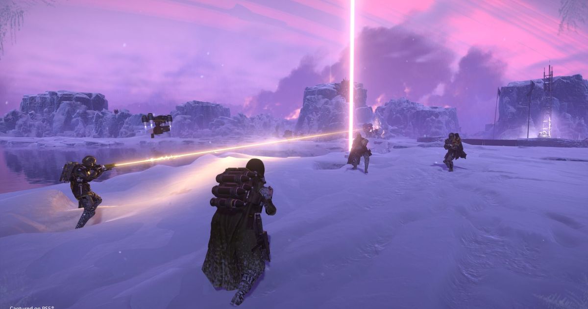 Helldivers 2 player standing in snow with teammates and light beams in background