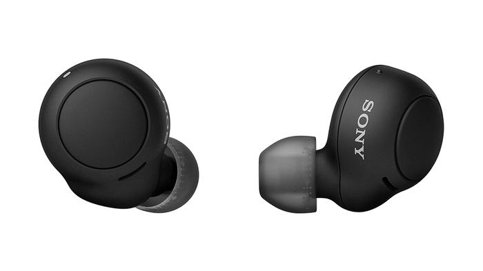 Best iPhone earbuds - Sony WF-C500 product image of a pair of round, black, wireless earbuds.