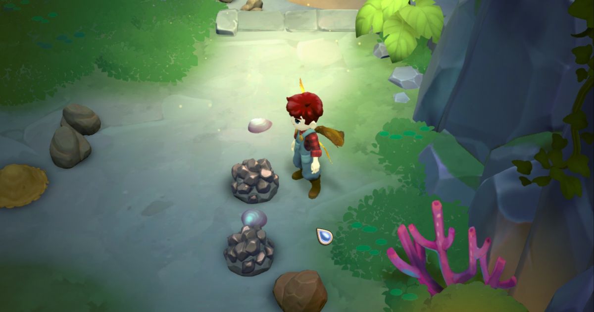 Fae Farm character stands near an iron deposit in the Saltwater Mine