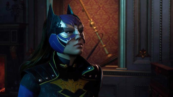 Batgirl walking through a richly furnished room in Gotham Knights